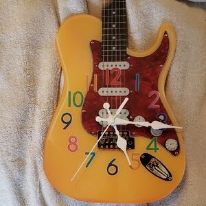 Bright Yellow Guitar Wall Clock with Multicolor Numerals